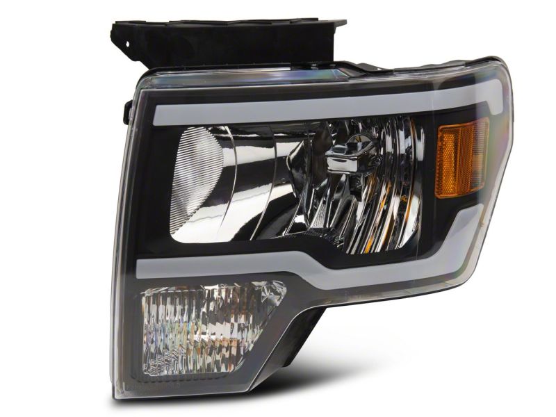 Raxiom 09-14 Ford F-150 Axial Series Headlight w/ SEQL LED Bar- Black Housing (Clear Lens)